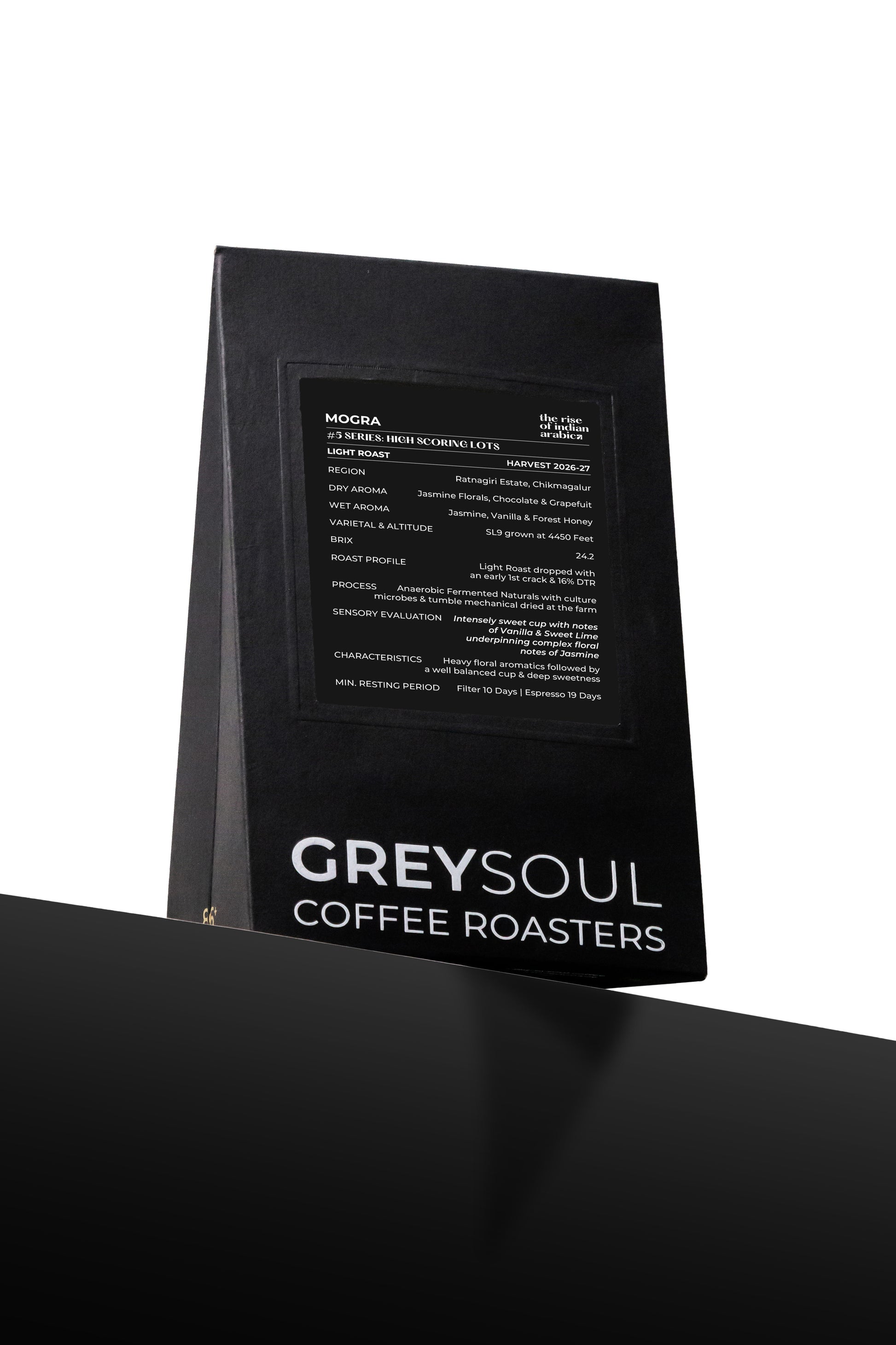 Black coffee bag with text detailing coffee flavor profile and brand name on a white background grey soul coffee mogra